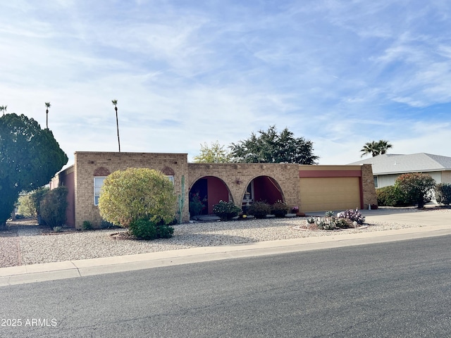 ranch-style house featuring a garage