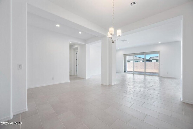 unfurnished room featuring baseboards, visible vents, a notable chandelier, and recessed lighting