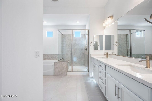 full bath with double vanity, a sink, a shower stall, and a bath