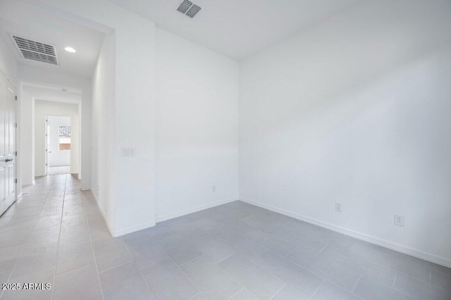 empty room with recessed lighting, visible vents, baseboards, and light tile patterned floors