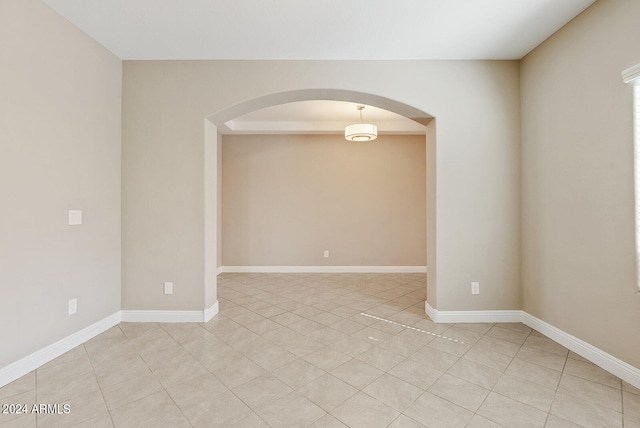 empty room with light tile patterned floors