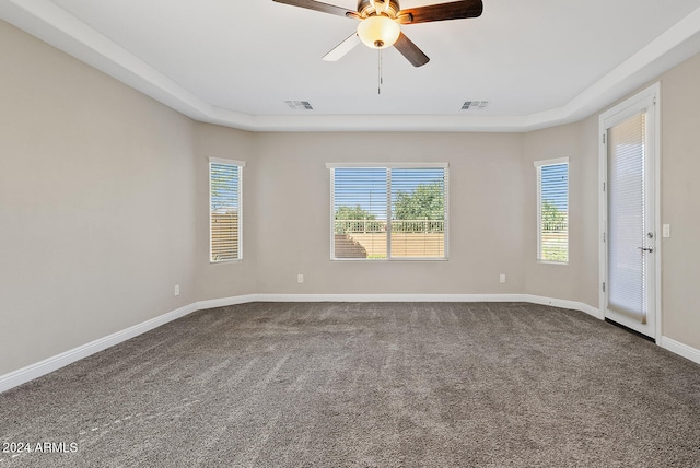 carpeted spare room with ceiling fan