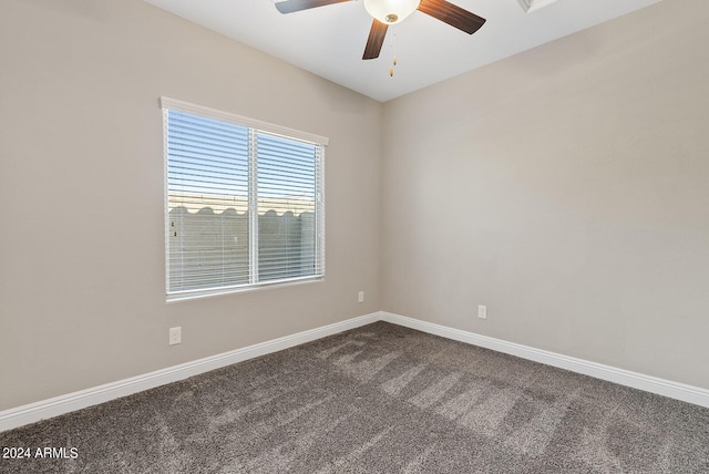 unfurnished room featuring ceiling fan and carpet