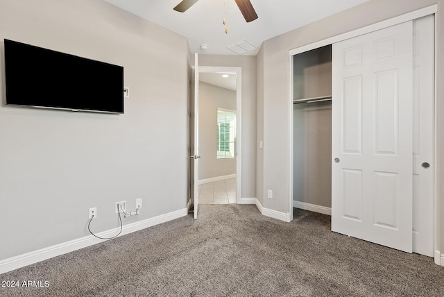 unfurnished bedroom with ceiling fan and carpet flooring