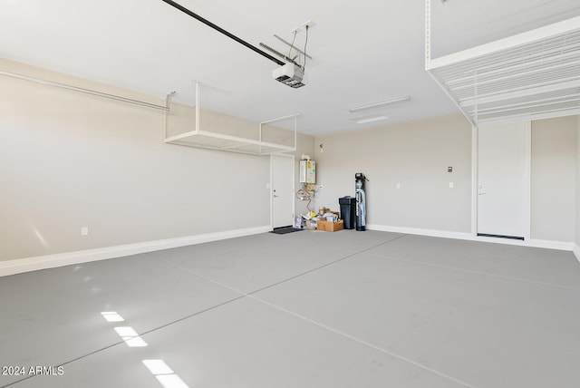 garage with a garage door opener and water heater