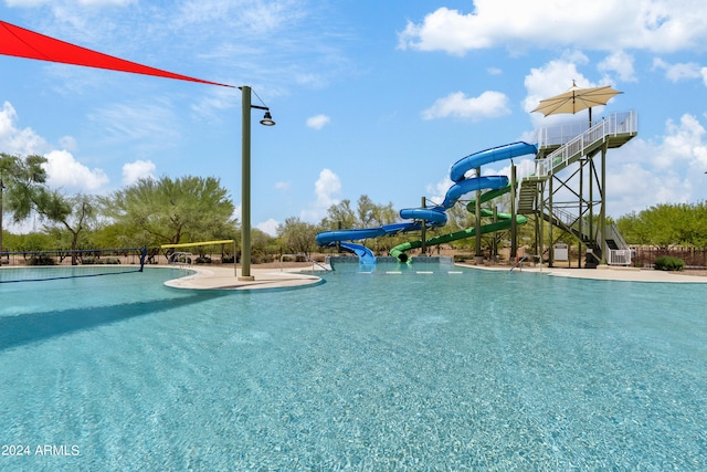 view of pool featuring a water slide