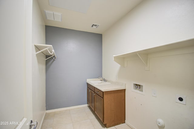 laundry area featuring a sink, washer hookup, visible vents, and hookup for an electric dryer