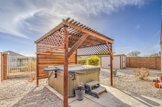 view of patio / terrace with a fenced backyard, a storage shed, an outdoor structure, a pergola, and a hot tub