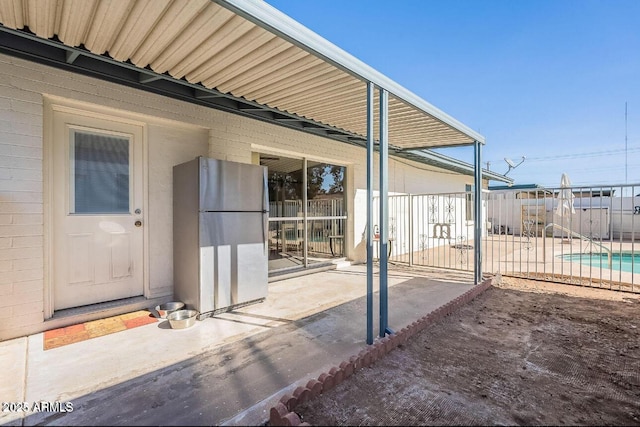view of patio / terrace featuring fence