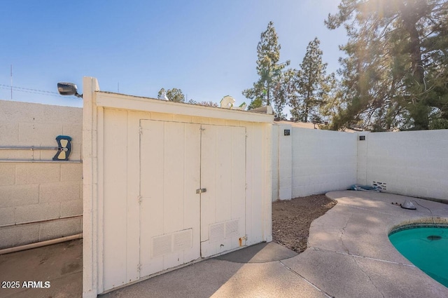 view of shed featuring a fenced backyard