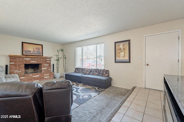 living area featuring light carpet, a brick fireplace, light tile patterned floors, and a textured ceiling