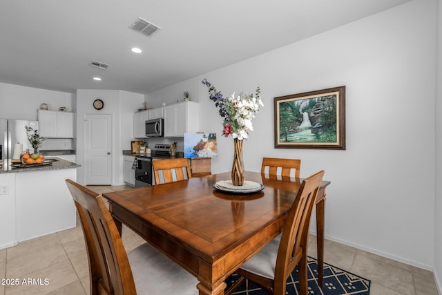 dining space featuring light tile patterned floors, visible vents, recessed lighting, and baseboards