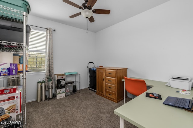 carpeted home office with a ceiling fan