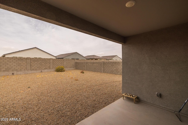 view of yard with a patio and a fenced backyard