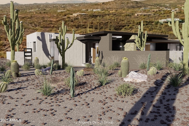 view of front of home featuring fence