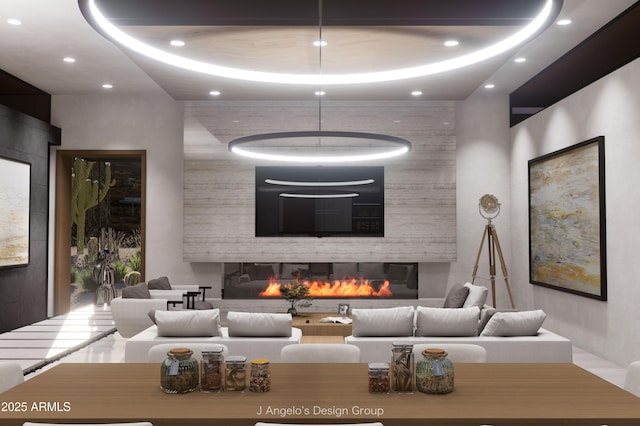 living area with a large fireplace and recessed lighting