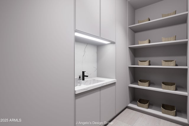 bathroom featuring tasteful backsplash and vanity