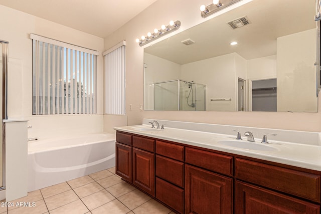 bathroom with tile patterned flooring, vanity, and independent shower and bath