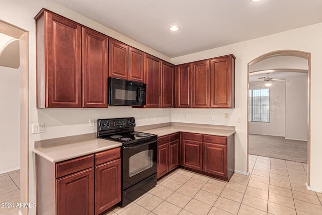 kitchen with black appliances, ceiling fan, and light tile patterned flooring