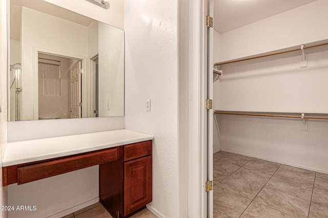 bathroom with tile patterned flooring and vanity