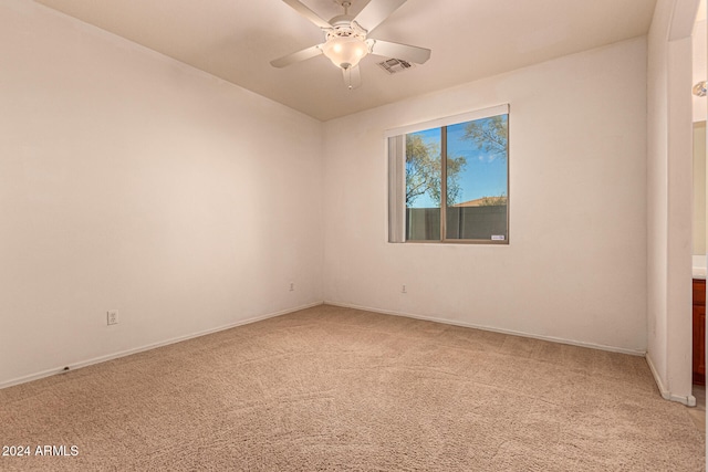 carpeted empty room with ceiling fan