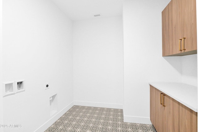 19355 N 73rd Way Unit 4002, Scottsdale, AZ 85255 - washroom with electric dryer hookup, baseboards, cabinet space, and washer hookup