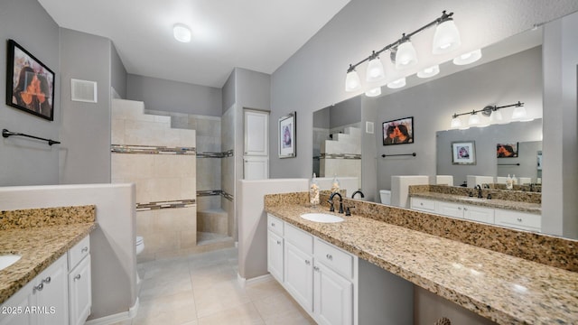 15252 N 100th St Unit 1134, Scottsdale, AZ 85260 - full bathroom with toilet, tiled shower, tile patterned floors, and two vanities