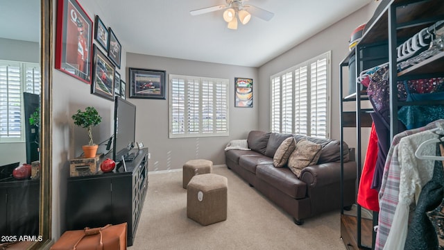 15252 N 100th St Unit 1134, Scottsdale, AZ 85260 - living area with healthy amount of natural light, carpet floors, a ceiling fan, and baseboards