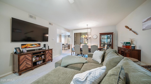15252 N 100th St Unit 1134, Scottsdale, AZ 85260 - carpeted living room featuring a chandelier and baseboards