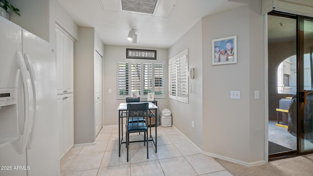 15252 N 100th St Unit 1134, Scottsdale, AZ 85260 - dining room featuring light tile patterned floors, a desk, and baseboards