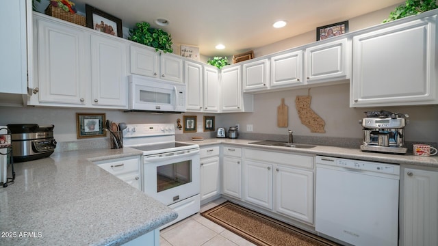 15252 N 100th St Unit 1134, Scottsdale, AZ 85260 - kitchen with white appliances, a sink, white cabinetry, and recessed lighting