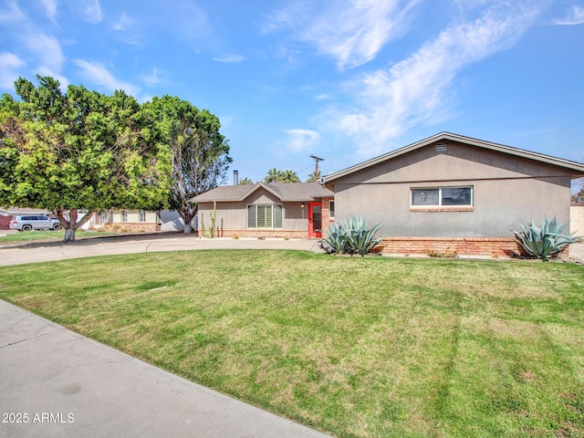 ranch-style house with a front lawn and stucco siding