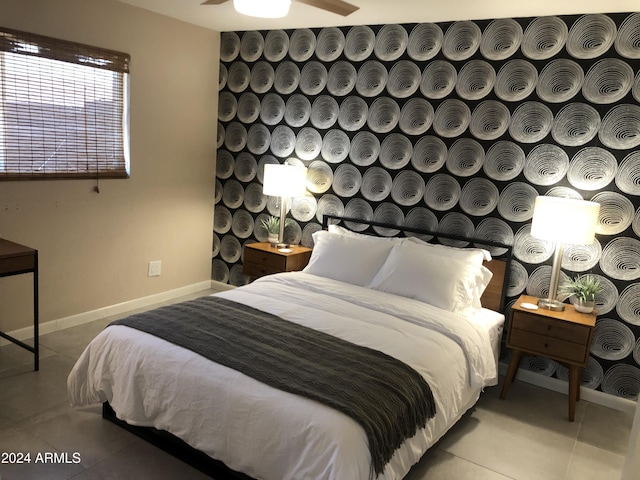 bedroom with tile patterned flooring and baseboards