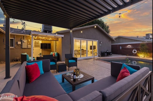 view of patio featuring an outdoor hangout area, central AC, and a fenced in pool