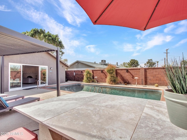 view of swimming pool featuring a fenced in pool, a patio area, and a fenced backyard