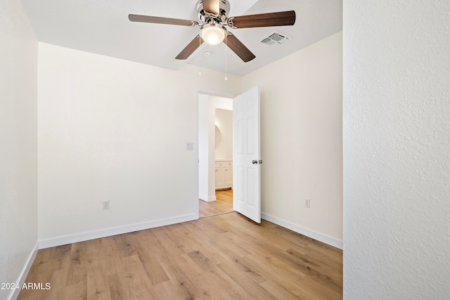 unfurnished room featuring light hardwood / wood-style flooring and ceiling fan