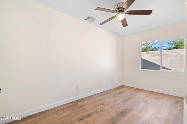 unfurnished room featuring ceiling fan and light hardwood / wood-style flooring