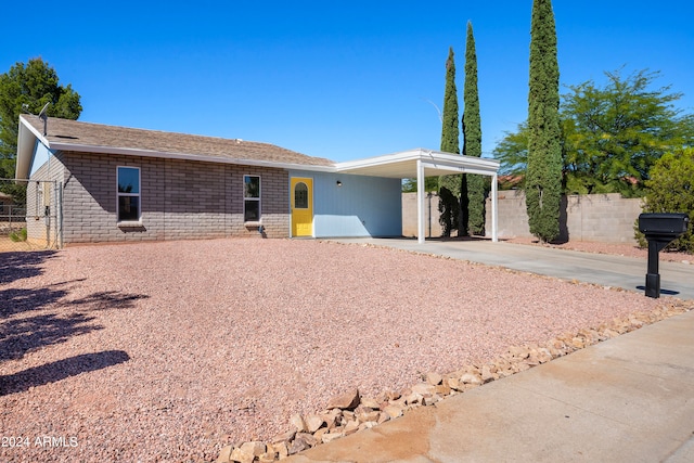 ranch-style home with a carport