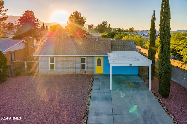 view of front of home with a carport