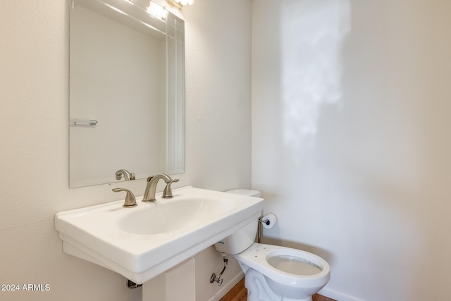 bathroom with toilet and sink