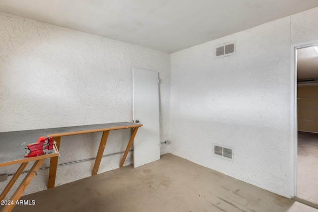 empty room featuring concrete flooring