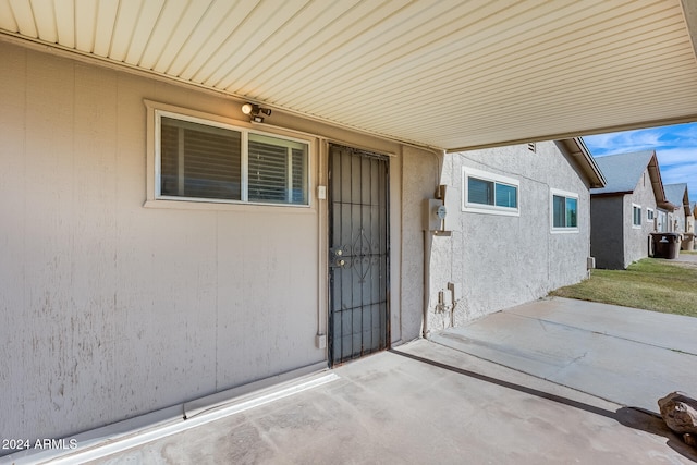 view of exterior entry featuring a patio