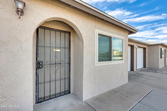 doorway to property with a patio area