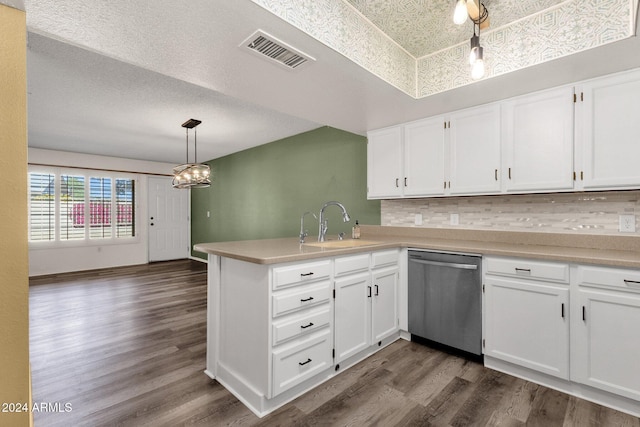 kitchen featuring kitchen peninsula, stainless steel dishwasher, dark hardwood / wood-style floors, white cabinetry, and hanging light fixtures