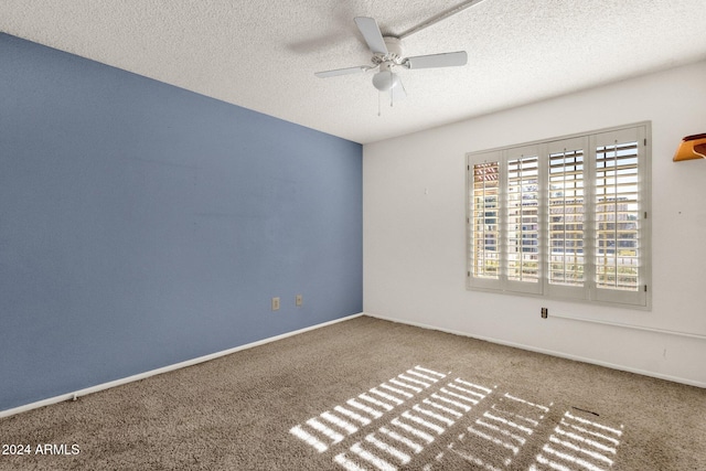 unfurnished room with carpet, a textured ceiling, and ceiling fan