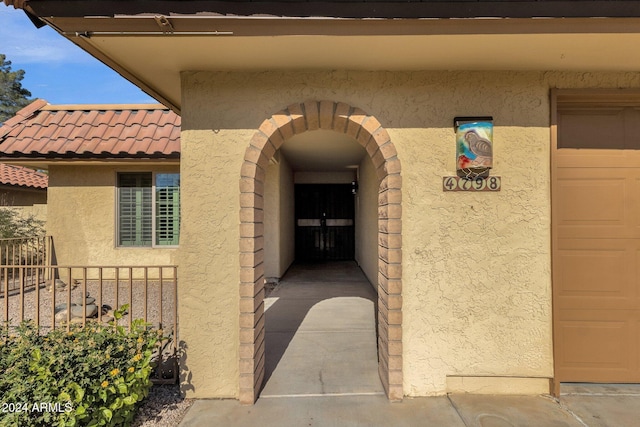 property entrance with a garage