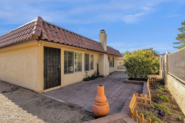 back of property featuring a patio