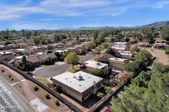 birds eye view of property with a mountain view