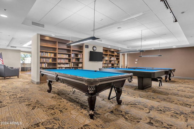 rec room with carpet, pool table, and a tray ceiling