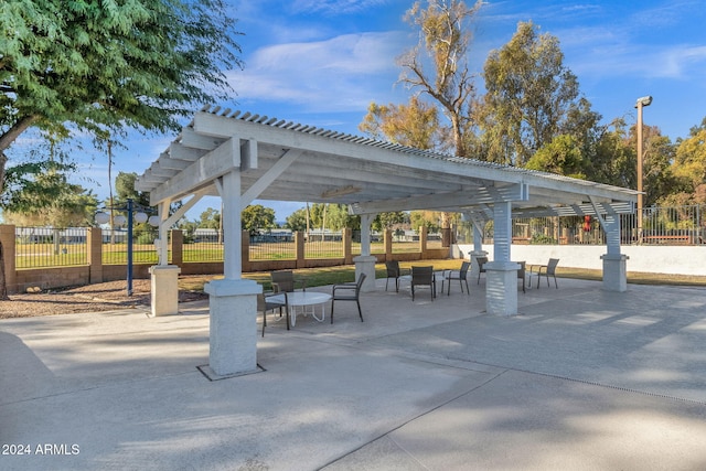 surrounding community featuring a pergola and a patio area